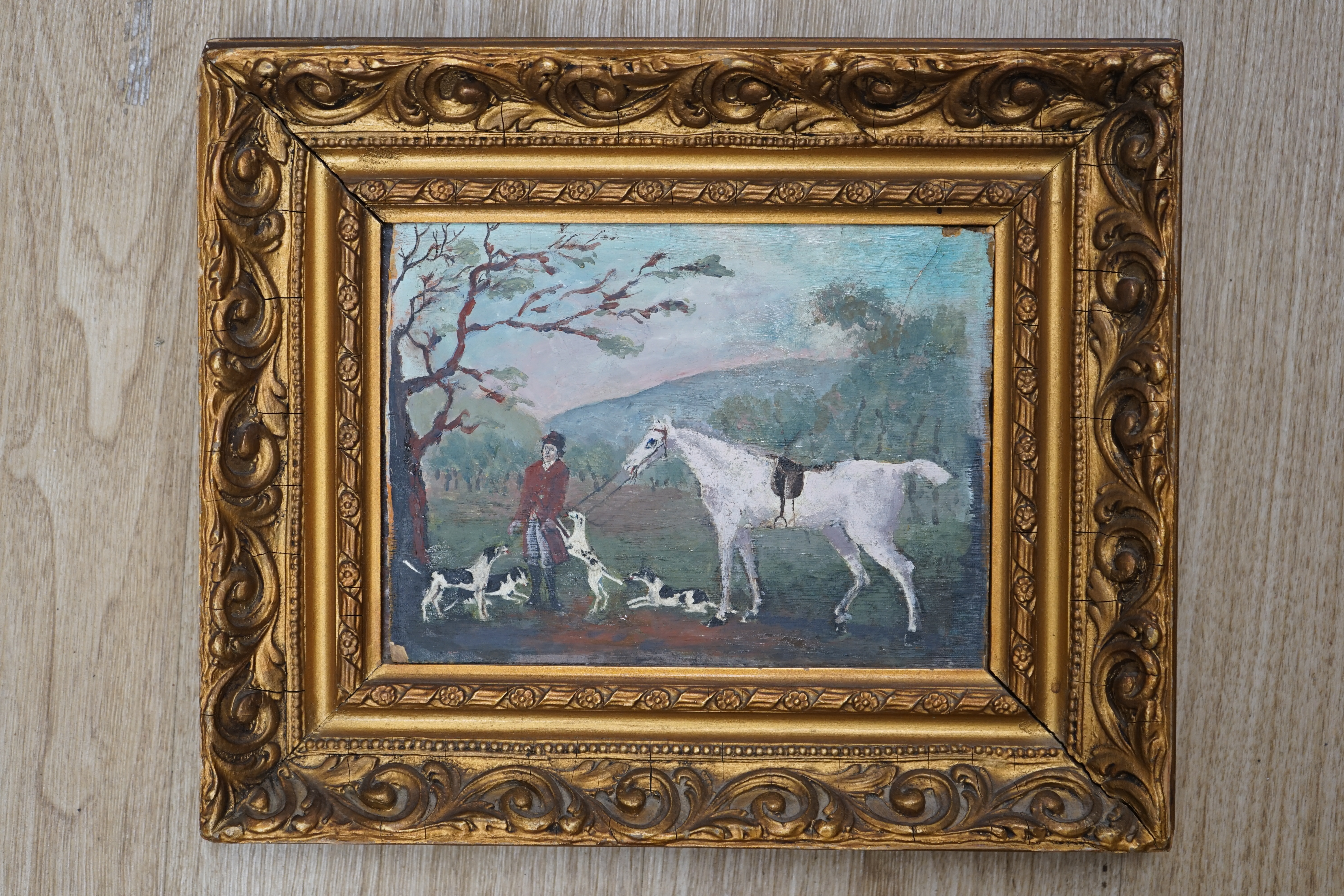 Late 19th century, naive oil on board, Huntsman with hounds before a landscape, 16 x 22cm, gilt framed. Condition - poor to fair